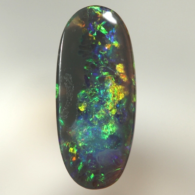 SOLID BLACK OPAL Bright sparkles of orange and green with a touch blue